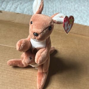 Ty beanie baby. Kangaroo with baby. “Pouch” Great condition. Tag still attached.
